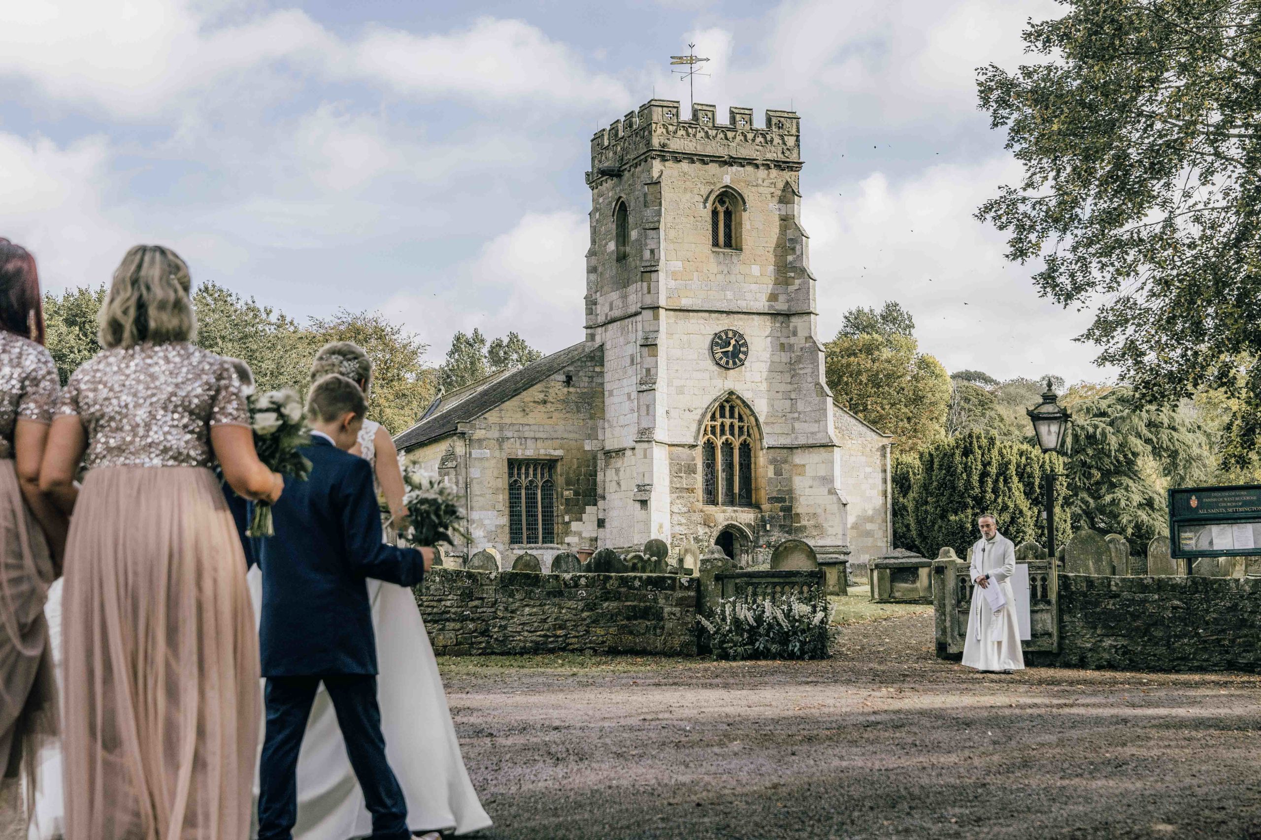 Bride walking towards all saints church settrington