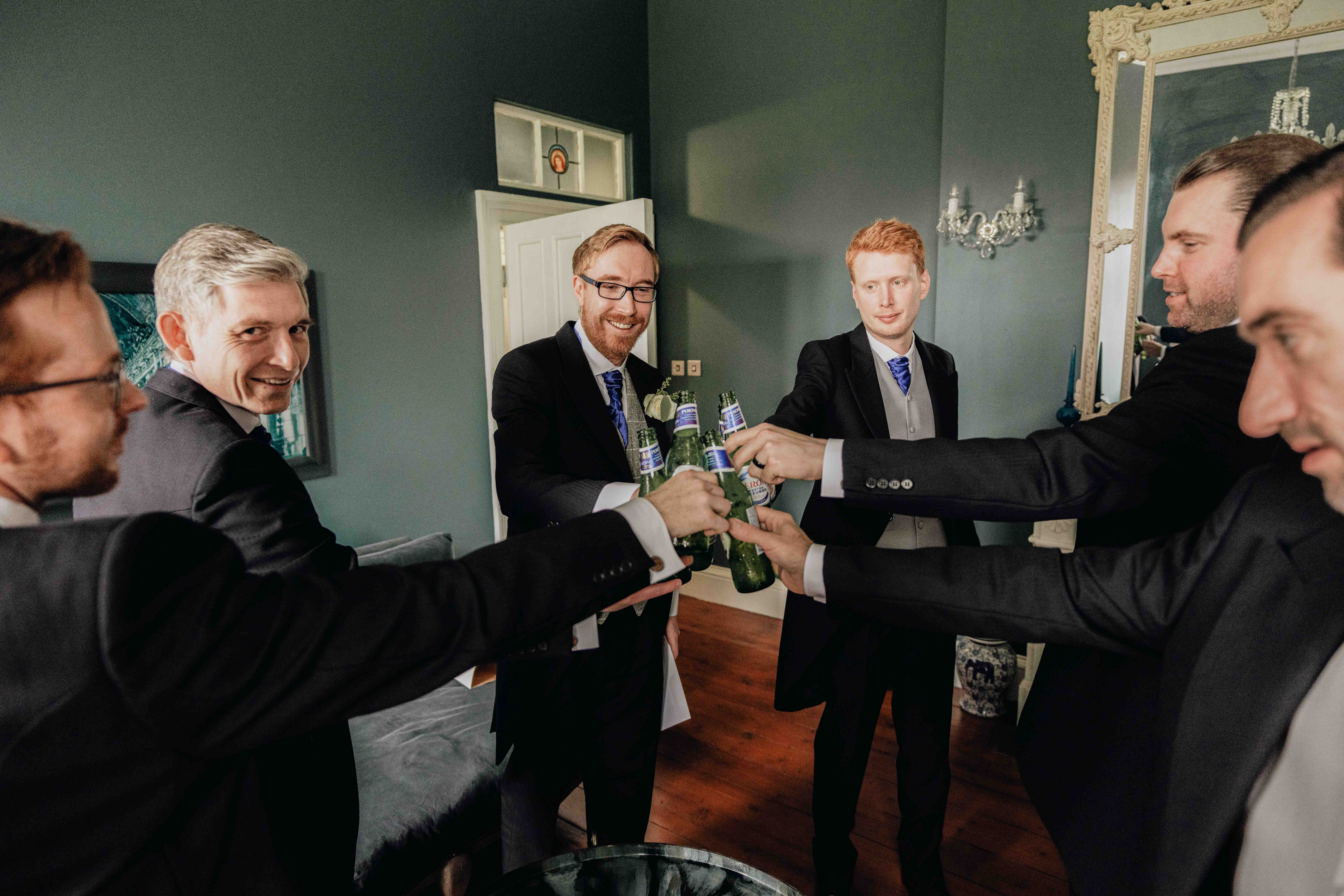 Lads having drinks before wedding ceremony at Thicket priory