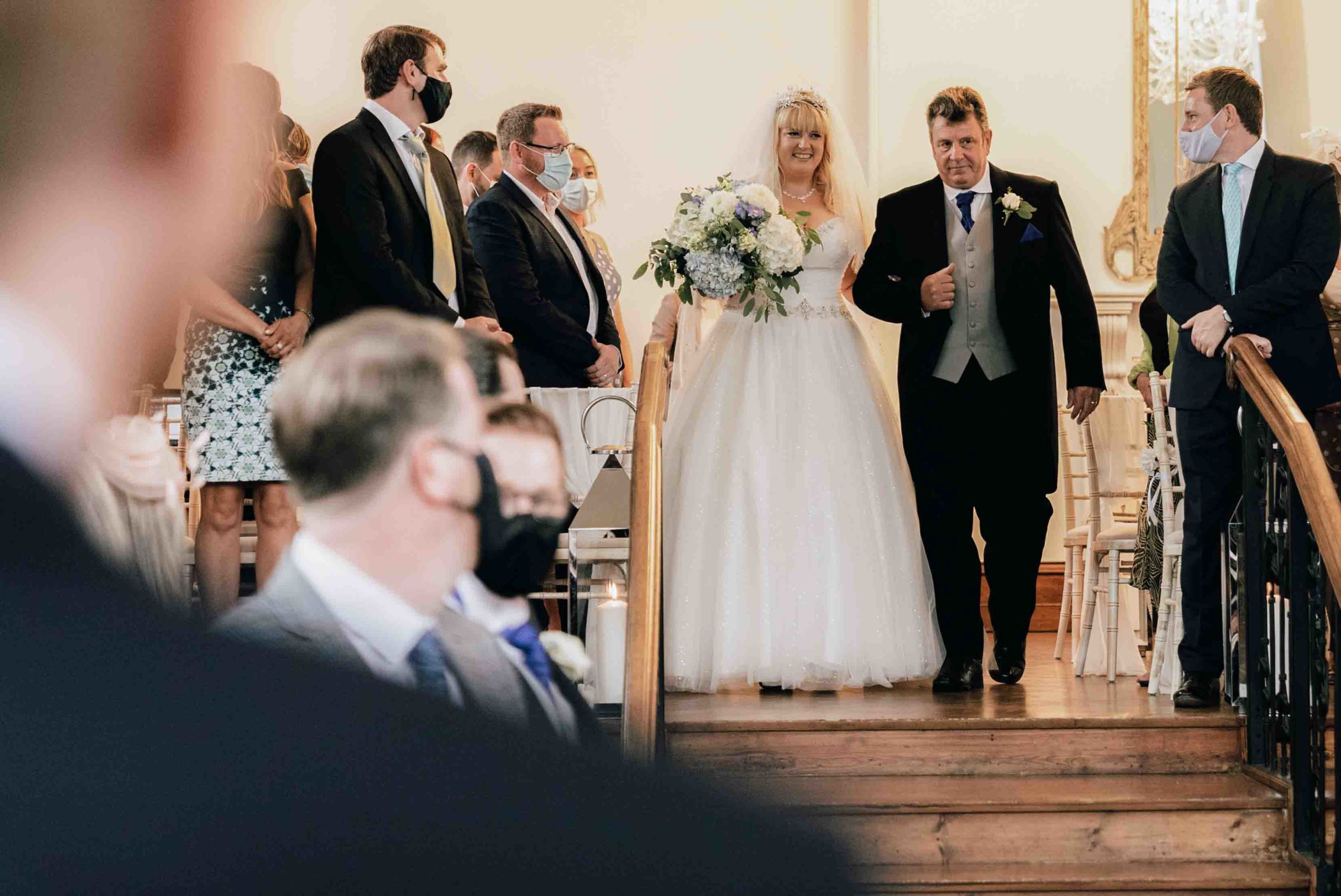 Bride walking down the aisle at Thicket Priory