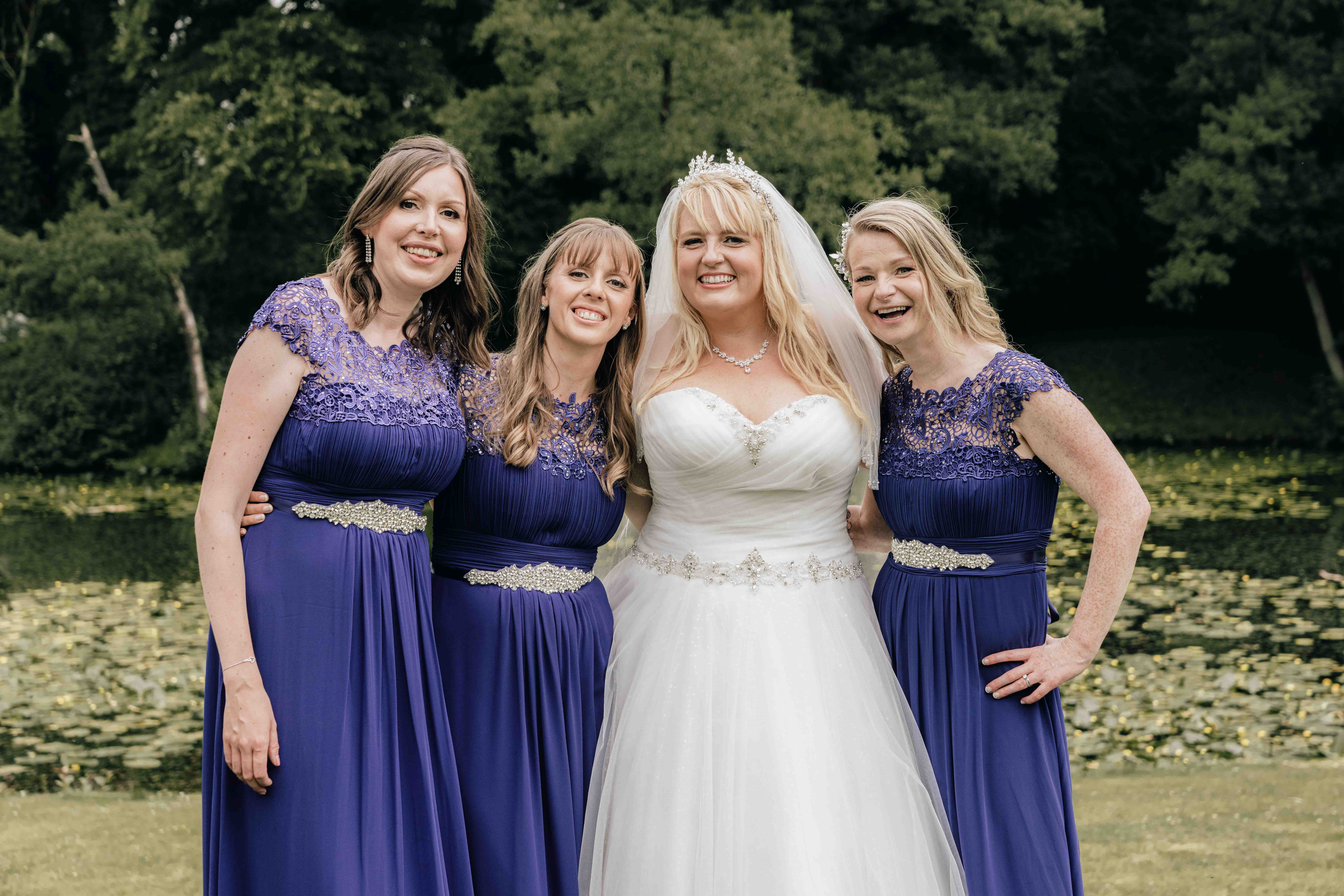Bride with bridesmaids on Thicket priory Lawn
