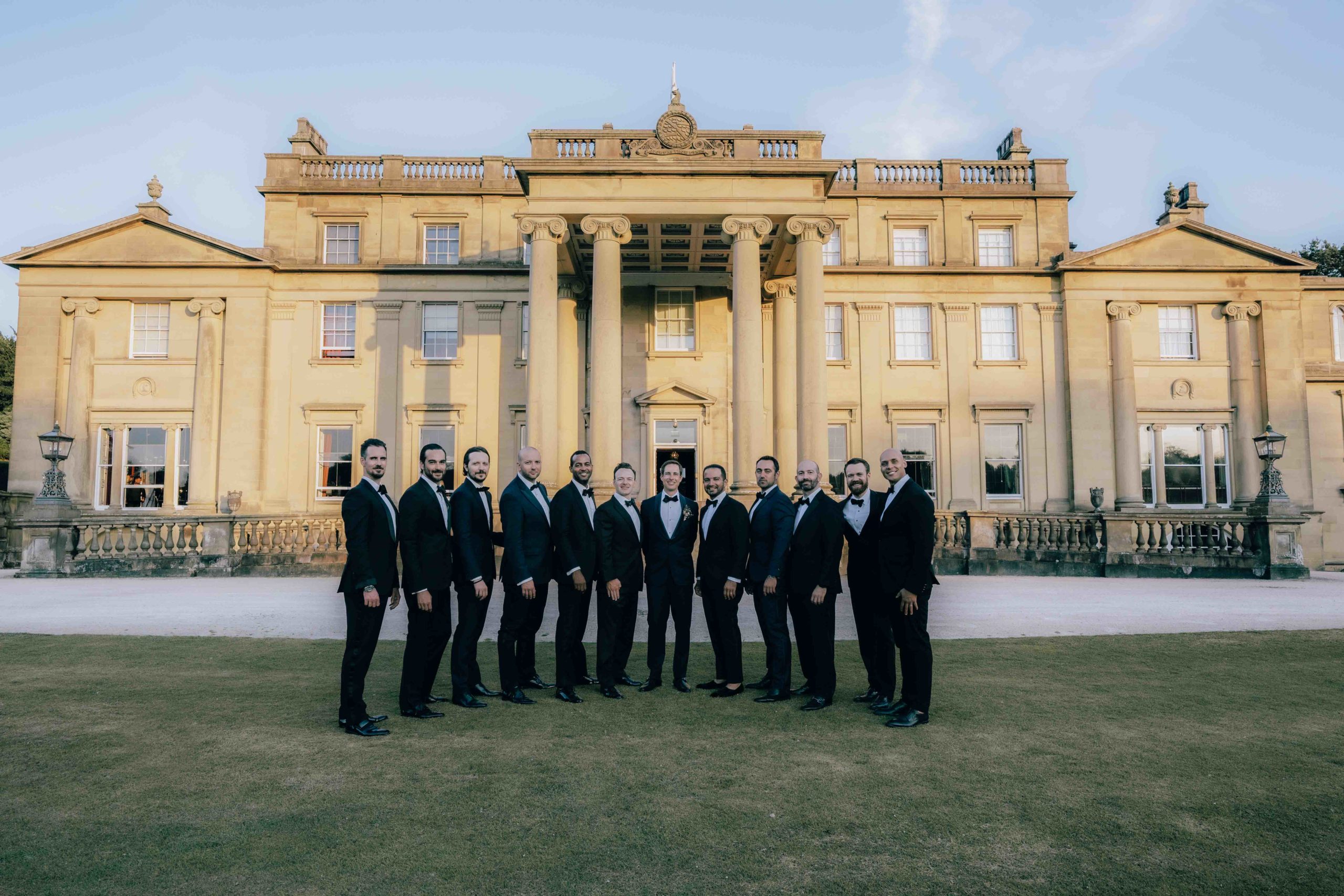 Groomsmen in front of Broughton Hall