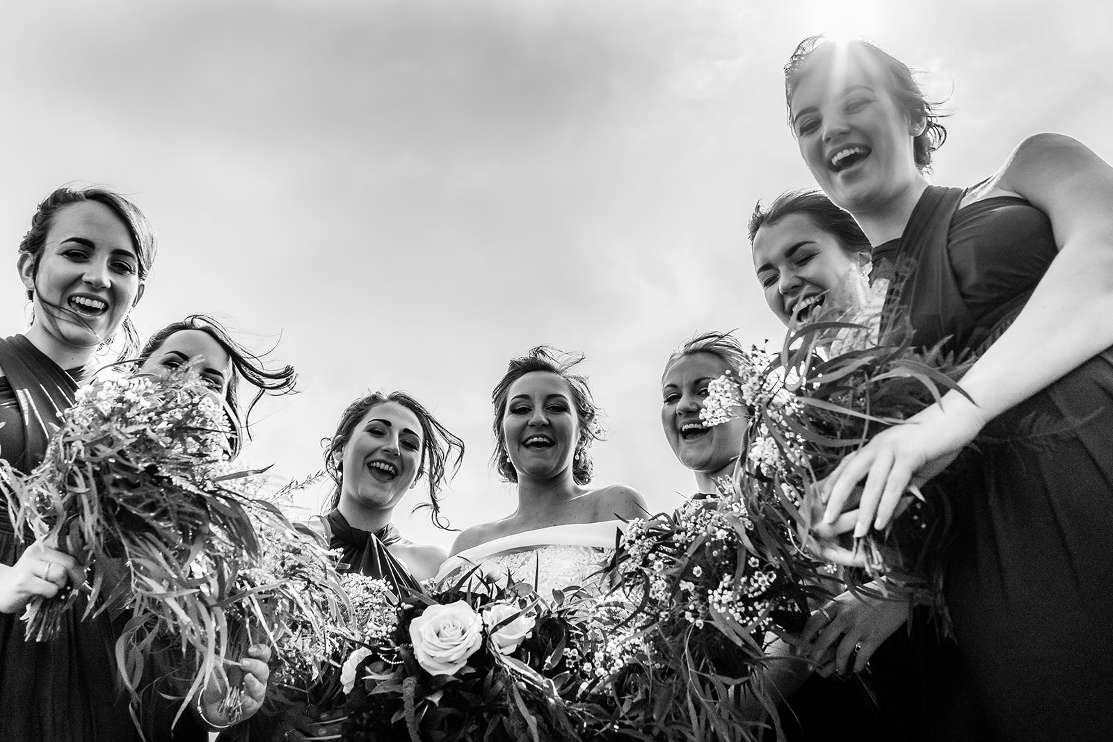 Bride and her bridesmaids at the wedding having fun