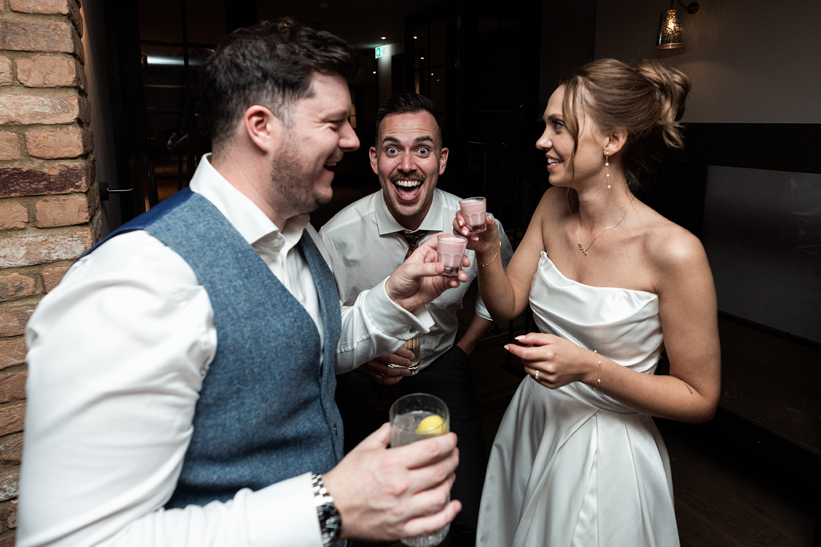 Wedding couple drinking shots