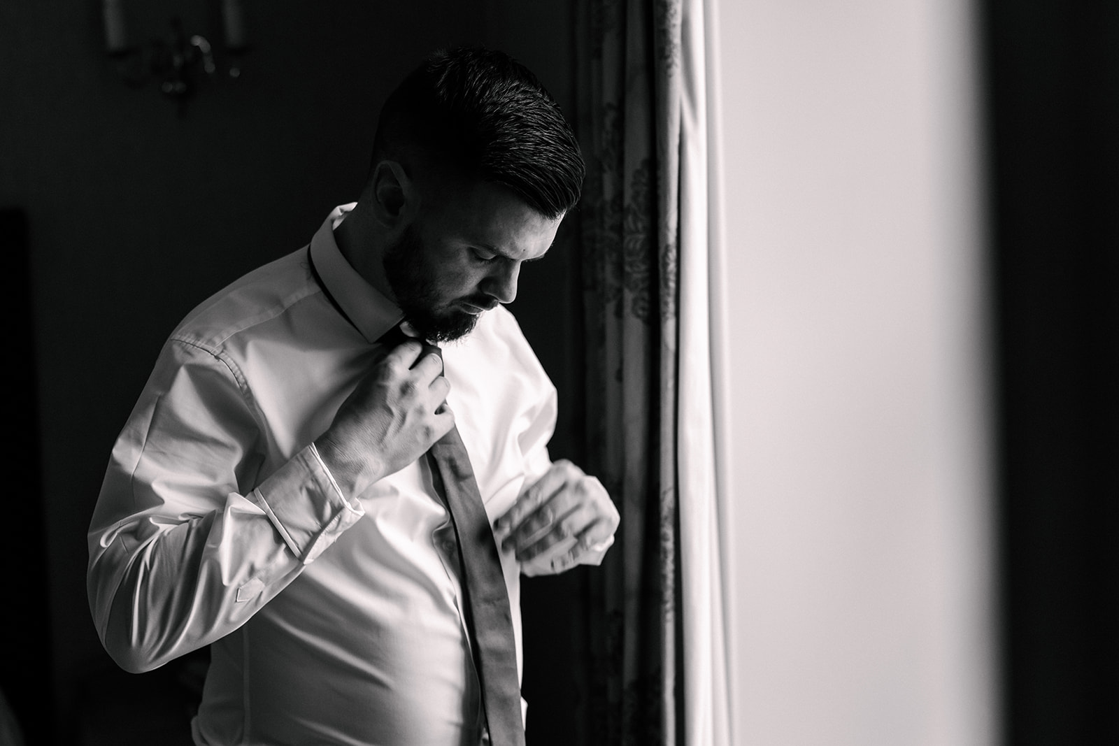 Groom getting ready photo before elopement
