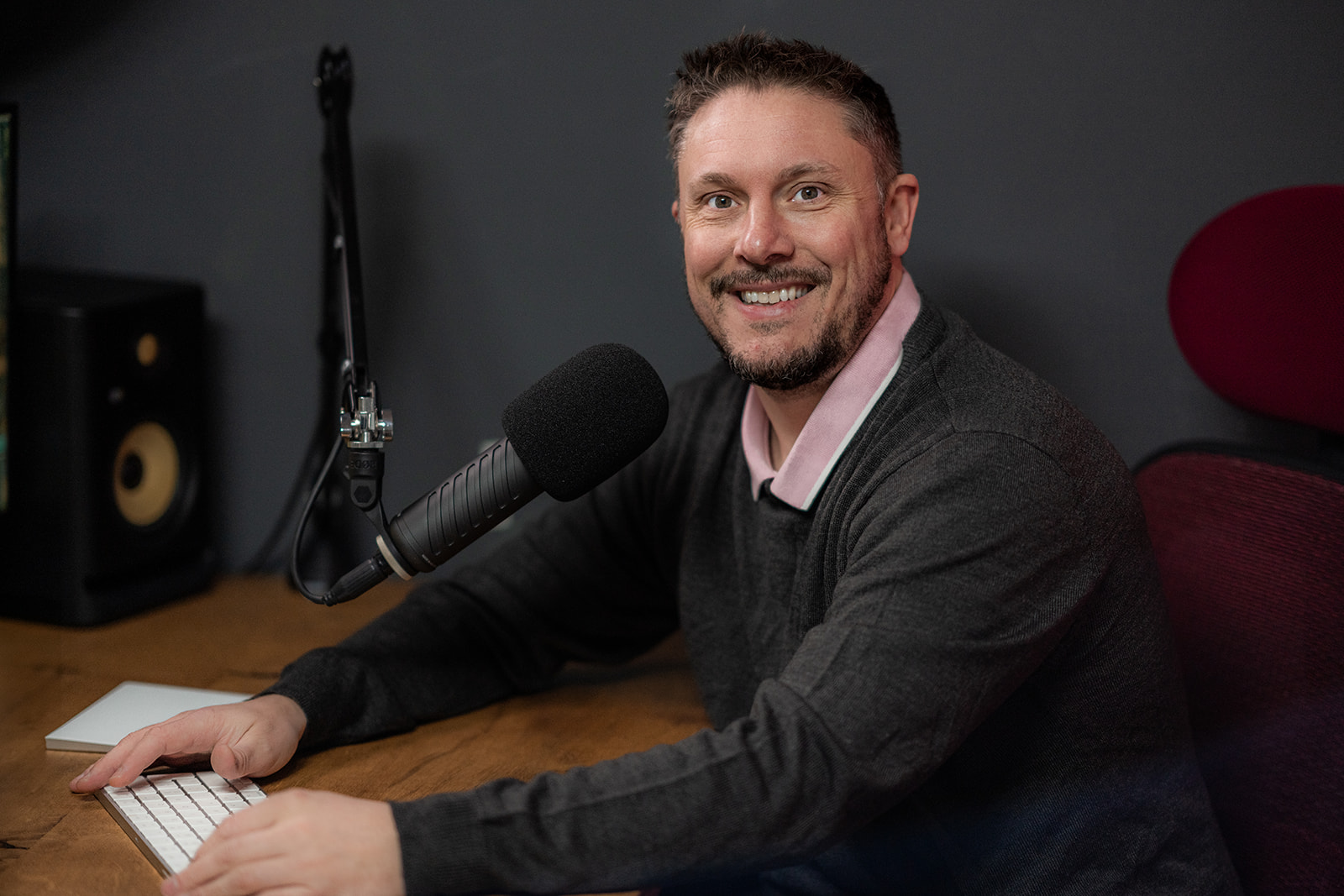Jules from Your Story Studios with podcast microphone